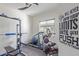 Bright workout room with exercise equipment and motivational wall art at 3408 S 184Th Ln, Goodyear, AZ 85338