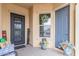 Cozy front porch featuring decorative wreaths, floral arrangements, and comfortable seating at 3408 S 184Th Ln, Goodyear, AZ 85338