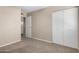 Spacious bedroom with neutral tones and carpeted floor with a double closet at 3511 E Baseline Rd # 1076, Phoenix, AZ 85042