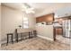 Bright dining area features neutral decor, drop leaf table, and views into the adjoining kitchen area at 3511 E Baseline Rd # 1076, Phoenix, AZ 85042