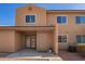 Inviting two-story townhome featuring neutral stucco and well-maintained landscaping under a bright, clear sky at 3511 E Baseline Rd # 1076, Phoenix, AZ 85042