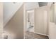 Hallway view into the bathroom with neutral colors and a clean, inviting design at 3511 E Baseline Rd # 1076, Phoenix, AZ 85042