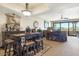 Stylish dining area with wooden furniture, decorative accents, and seamless flow into the living spaces at 36601 N Mule Train N Rd # D16, Carefree, AZ 85377