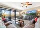 Comfortable living room featuring large sliding doors and scenic mountain views beyond the balcony at 36601 N Mule Train N Rd # D16, Carefree, AZ 85377