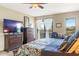 Bright main bedroom with natural light, comfortable bed, and views of the surrounding mountain scenery at 36601 N Mule Train N Rd # D16, Carefree, AZ 85377