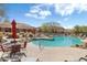 Community pool with tables and chairs perfect for relaxing at 36601 N Mule Train N Rd # D16, Carefree, AZ 85377