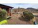 View of the desert landscaping and gravel yard in the backyard at 37448 N 301St Ave, Wittmann, AZ 85361