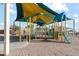 Well-maintained community playground featuring modern climbing and sliding structures for children at 38055 W Bello Ln, Maricopa, AZ 85138