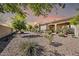 Beautiful backyard featuring desert landscaping, a covered patio and sunset sky at 3931 N 163Rd Dr, Goodyear, AZ 85395