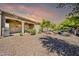 Beautiful backyard featuring desert landscaping, a covered patio and sunset sky at 3931 N 163Rd Dr, Goodyear, AZ 85395