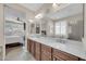 Bathroom with dual sinks, a shower, and a serene atmosphere at 3931 N 163Rd Dr, Goodyear, AZ 85395