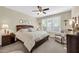 Comfortable bedroom featuring soft lighting, a ceiling fan, and neutral tones at 3931 N 163Rd Dr, Goodyear, AZ 85395