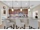 A kitchen featuring pendant lighting, stainless steel appliances, and a granite island at 3931 N 163Rd Dr, Goodyear, AZ 85395