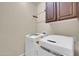 Well-equipped laundry room with modern appliances and ample space at 3931 N 163Rd Dr, Goodyear, AZ 85395