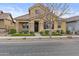 Lovely two-story home featuring a cozy porch, stone accents, and a well-manicured front lawn at 4457 E Bernice St, Gilbert, AZ 85295