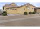 Single-story home with a two-car garage, desert landscaping, and paver driveway at 4457 E Bernice St, Gilbert, AZ 85295