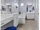 Luxury bathroom featuring dual vanities, a soaking tub, and modern fixtures at 4457 E Bernice St, Gilbert, AZ 85295