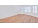 Bright bedroom with wood-look floors and natural light pouring in through the two shuttered windows at 4881 S Vista Pl, Chandler, AZ 85248