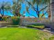 Welcome to Ocotillo Lakes. Beautiful community entrance with lush landscaping, mature trees, and a stone monument at 4881 S Vista Pl, Chandler, AZ 85248