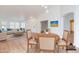 Bright dining room features modern lighting, wood floors, and open layout to the living area at 4881 S Vista Pl, Chandler, AZ 85248