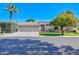 Charming home featuring a three-car garage, a tile roof, mature landscaping, and a well-maintained front yard at 4881 S Vista Pl, Chandler, AZ 85248