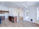 Spacious kitchen flows into living spaces, featuring modern island, wood floors, and plenty of natural light at 4881 S Vista Pl, Chandler, AZ 85248