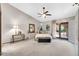 Bright bedroom with a vaulted ceiling, decorative furnishings, and natural light at 5421 E Michelle Dr, Scottsdale, AZ 85254