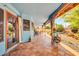 Expansive covered patio with Saltillo tile flooring, offering a relaxing outdoor living space at 5421 E Michelle Dr, Scottsdale, AZ 85254