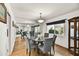 Elegant dining room featuring round table, six chairs, and large mirror at 6310 E Avalon Dr, Scottsdale, AZ 85251