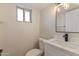 Updated bathroom features marble countertop and modern fixtures at 6802 N 22Nd Pl, Phoenix, AZ 85016