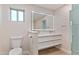 Elegant bathroom featuring double sinks, illuminated mirror, and luxury fixtures at 6802 N 22Nd Pl, Phoenix, AZ 85016