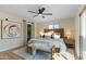 Relaxing bedroom features a king-size bed, ceiling fan, and an artistic sliding door with natural light, creating a tranquil retreat at 6802 N 22Nd Pl, Phoenix, AZ 85016