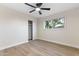 Comfortable bedroom featuring a ceiling fan, closet, window, and neutral paint at 6802 N 22Nd Pl, Phoenix, AZ 85016