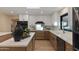 Bright kitchen featuring a mix of white and wooden cabinets, a modern sink, and stylish decor at 6802 N 22Nd Pl, Phoenix, AZ 85016