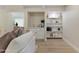 Living room with built in bar, stylish seating area and wood-look tile flooring, offering a perfect blend of style and comfort at 6802 N 22Nd Pl, Phoenix, AZ 85016