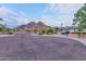 Property nestled near scenic mountains, featuring verdant landscaping, and a quiet neighborhood street at 6802 N 22Nd Pl, Phoenix, AZ 85016