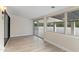 Sunroom with tiled floor, window view, and access to backyard patio at 6802 N 22Nd Pl, Phoenix, AZ 85016