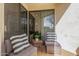 Private patio features tile flooring and two seating areas at 6900 E Princess Dr # 1228, Phoenix, AZ 85054