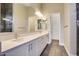 Modern bathroom featuring double sinks, white cabinetry, and sleek tile flooring at 7210 E Camino Rayo De Luz --, Scottsdale, AZ 85266