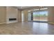 Open living room featuring tile floors, fireplace, and sliding glass doors to the patio at 7210 E Camino Rayo De Luz --, Scottsdale, AZ 85266