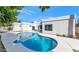 Resort-style backyard with a sparkling pool and lush landscaping creates a private oasis at 8336 N 72Nd Pl, Scottsdale, AZ 85258