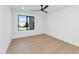 Bright bedroom with large window and ceiling fan at 8336 N 72Nd Pl, Scottsdale, AZ 85258