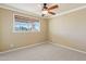 Bedroom with a ceiling fan and a view from a window at 9120 W Villa Lindo Dr, Peoria, AZ 85383