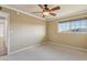 Bedroom with a ceiling fan and a view from a window at 9120 W Villa Lindo Dr, Peoria, AZ 85383