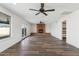 Spacious living room has tile floors, a brick fireplace, and natural light at 9120 W Villa Lindo Dr, Peoria, AZ 85383