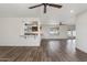 Open-concept living space with wood-look tile flooring and plenty of natural light at 9120 W Villa Lindo Dr, Peoria, AZ 85383