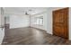 Bright living room featuring a large window, tile floors and a wooden front door at 9120 W Villa Lindo Dr, Peoria, AZ 85383