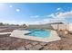 Backyard showcasing a pool with desert landscaping, rock accents, and a block privacy fence at 9120 W Villa Lindo Dr, Peoria, AZ 85383