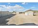 Wide view of property with outbuildings and perimeter block wall at 9120 W Villa Lindo Dr, Peoria, AZ 85383