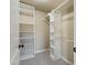 Organized walk-in closet with shelves and hanging rods for efficient storage at 9120 W Villa Lindo Dr, Peoria, AZ 85383